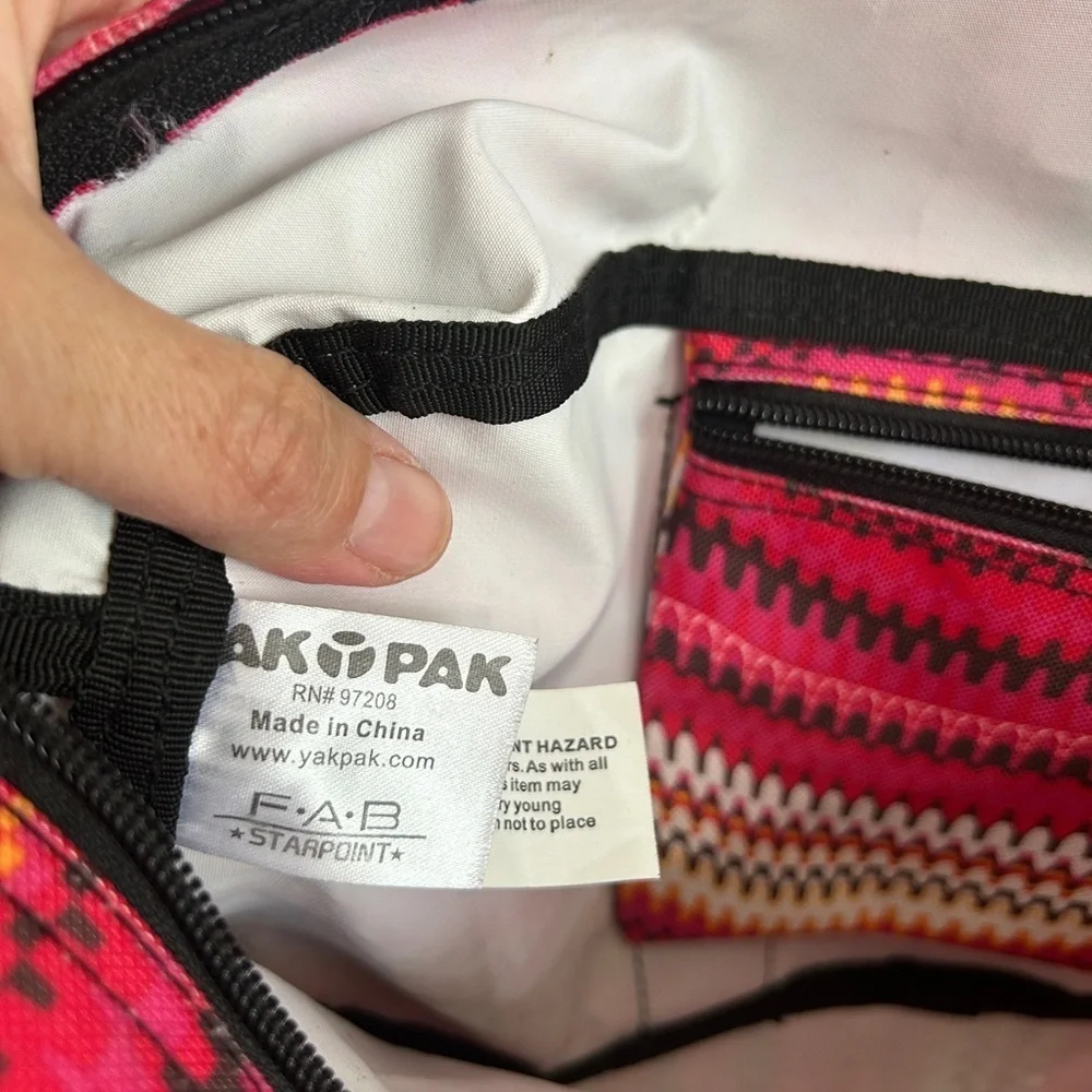 Like new YakPak duffle bag. Pink colorful zigzag design with black details